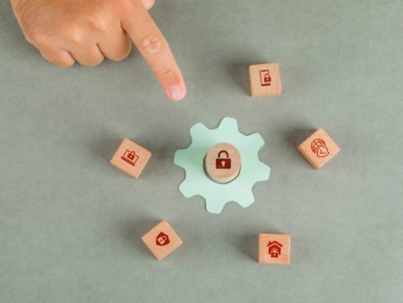 conceptual-of-data-privacy-man-hand-pointing-with-wooden-blocks-paper-settings-icon (1)